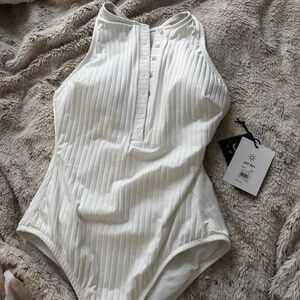 Sculpting, smoothing white racer back one piece bathing suit